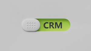 CRM letter on slide switch, rendering on green background.