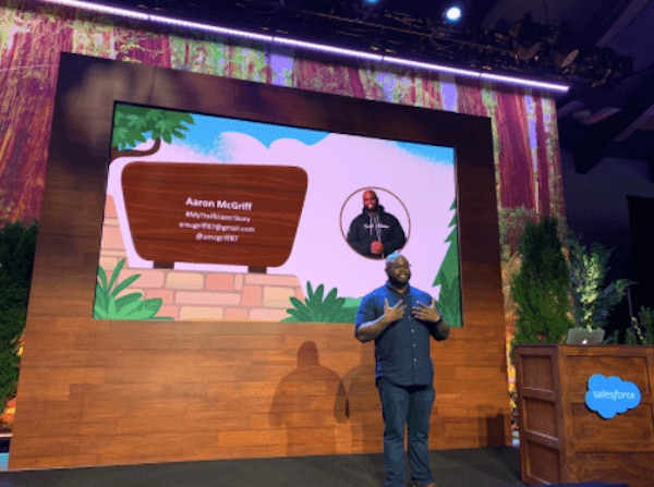 Aaron on-stage at a Salesforce event
