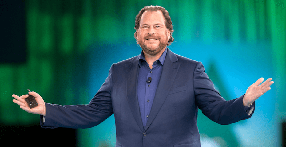 Marc Benioff, co-founder and CEO of Salesforce, pictured in a professional portrait wearing a dark suit and smiling thoughtfully, representing his visionary leadership in cloud computing and the 1-1-1 philanthropy model that drives positive business and societal change.