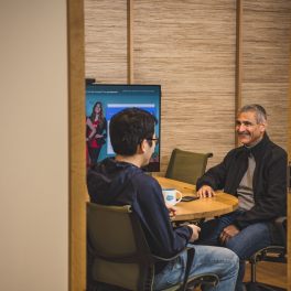 Salesforce employees meet at a conference room in the Bellevue office.