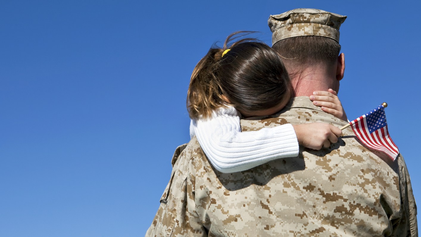 Military Man Hugging His Daughter
