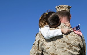 Military Man Hugging His Daughter