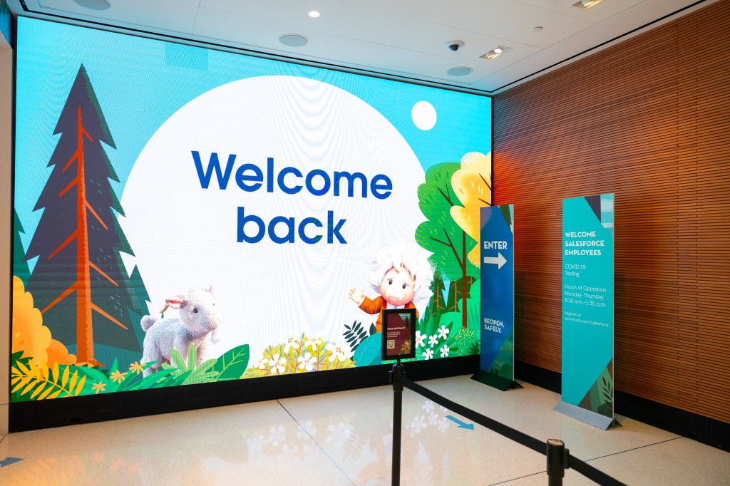 New lobby signage welcoming employees back to Salesforce Tower New York