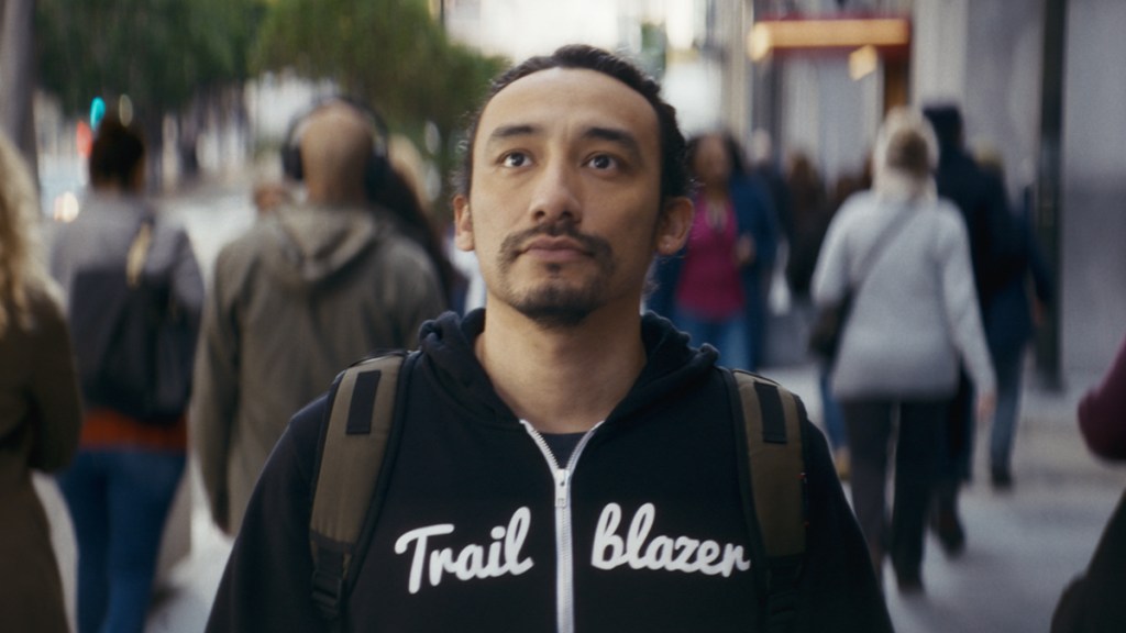 Person in Trailblazer Sweatshirt in New Frontier ad campaign