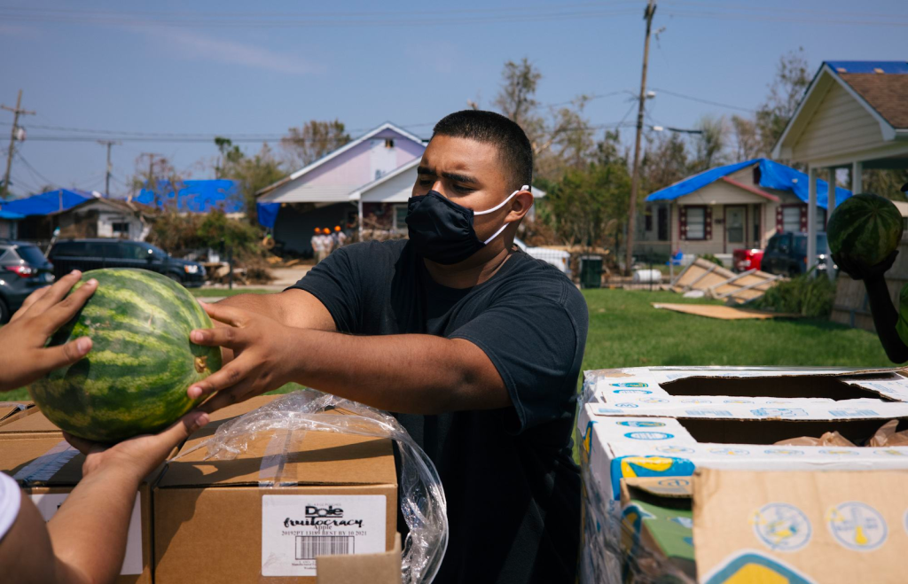 19-year-old Daniel helps out at a Feeding America food pantry in Houma, L.A. after Hurricane Ida.