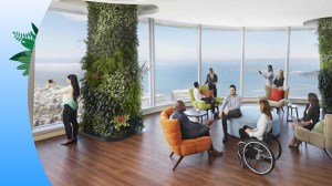 Several people are standing and seated in an open lounge in Salesforce’s San Francisco headquarters. This shows that Salesforce is making its spaces accessible for all.