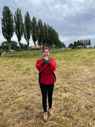 Hunziker shows off a few of the rocks she and her team moved after their tractor broke down. 
