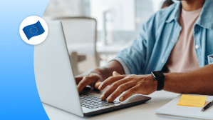 Man typing at a laptop