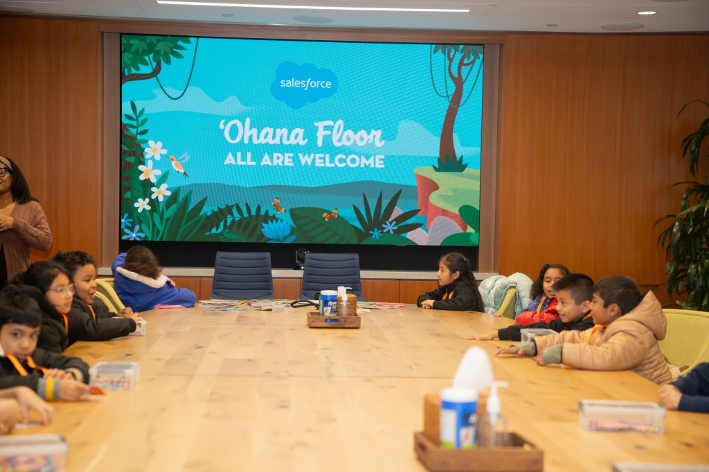 Employees, partners, and schoolchildren celebrate Giving Tuesday in New York City.