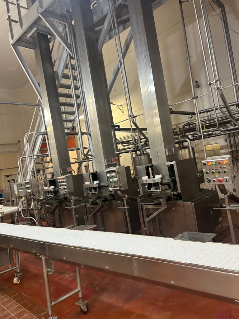 The cheese block forming towers are controlled by programmable logic computers, which Daniel has to program and debug when he’s not working in Salesforce or helping to make cheese.