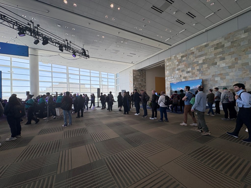 Attendees line up for the session "Apply Agentforce Vibes' Advanced Features"