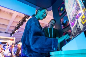Attendees interact with a music display at Dreamforce.