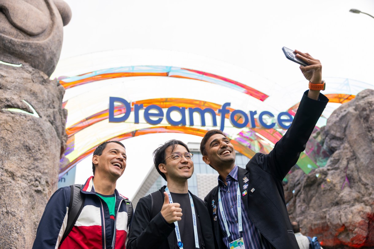 Attendees pose for a selfie at Dreamforce Park.