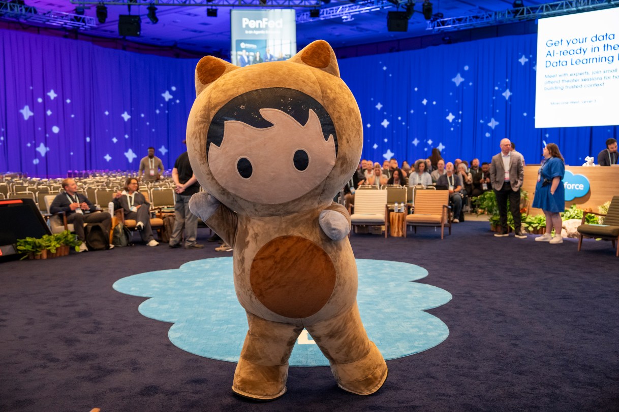 Astro mascot waves and poses for the camera before a Dreamforce 2026 session.